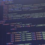 Close-up view of HTML and CSS code displayed on a computer screen, ideal for programming and technology themes.